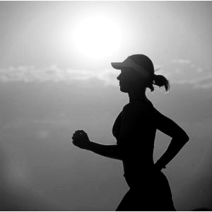 a woman's silhouette while jogger